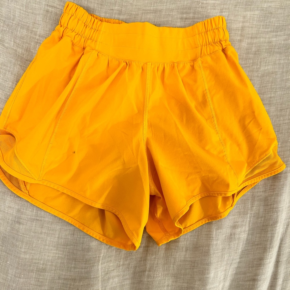 lululemon size 2 4”inseam orangish yellow shorts small stain on front